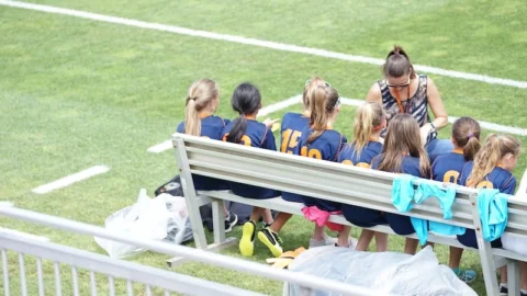 sports dietitian handing out snacks to soccer team
